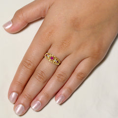 9K SOLID GOLD 0.30CT NATURAL RUBY NAVETTE STYLE RING WITH 2 DIAMONDS.
