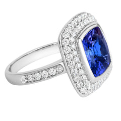 18K SOLID WHITE GOLD 6.52CT NATURAL TANZANITE RING WITH 68 VS/G DIAMONDS.