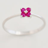 9K SOLID WHITE GOLD 0.20CT RUBY FLORAL CLUSTER RING WITH CENTRE DIAMOND.