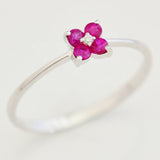 9K SOLID WHITE GOLD 0.20CT RUBY FLORAL CLUSTER RING WITH CENTRE DIAMOND.