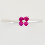 9K SOLID WHITE GOLD 0.20CT RUBY FLORAL CLUSTER RING WITH CENTRE DIAMOND.