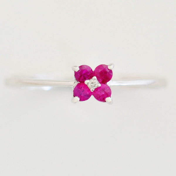 9K SOLID WHITE GOLD 0.20CT RUBY FLORAL CLUSTER RING WITH CENTRE DIAMOND.