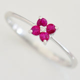 9K SOLID WHITE GOLD 0.20CT RUBY FLORAL CLUSTER RING WITH CENTRE DIAMOND.