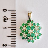 9K SOLID WHITE GOLD 0.85CT NATURAL EMERALD CLUSTER PENDANT WITH SEVEN DIAMONDS.