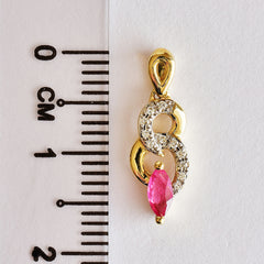9K SOLID YELLOW GOLD 0.20CT NATURAL RUBY PENDANT WITH ELEVEN DIAMONDS.