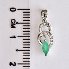 9K SOLID WHITE GOLD 0.17CT NATURAL EMERALD PENDANT WITH ELEVEN DIAMONDS.