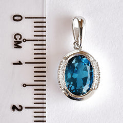 9K SOLID WHITE GOLD 1.90CT LONDON BLUE TOPAZ  PENDANT WITH TWELVE  DIAMONDS.