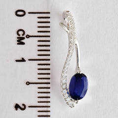 9K SOLID WHITE GOLD 0.60CT NATURAL BLUE SAPPHIRE PENDANT WITH TWENTY ONE DIAMONDS.